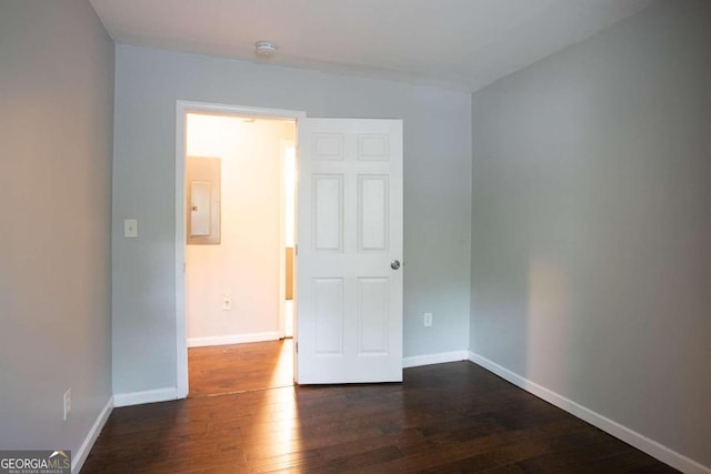 2836 Harlan Dr, Atlanta, GA 30344 - unfurnished room with dark wood-type flooring, baseboards, and electric panel