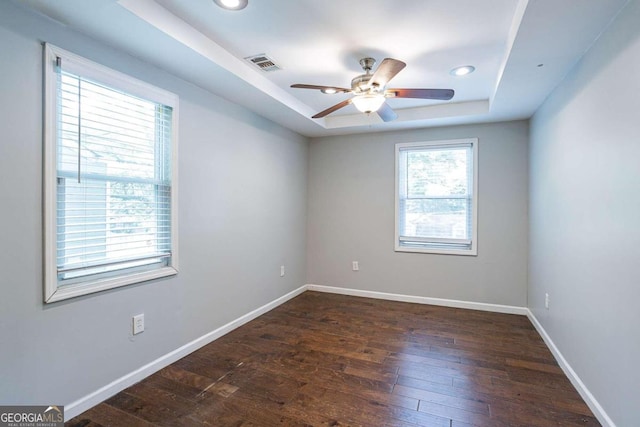 2836 Harlan Dr, Atlanta, GA 30344 - empty room with a ceiling fan, a raised ceiling, baseboards, visible vents, and hardwood / wood-style floors