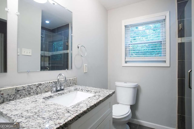 2836 Harlan Dr, Atlanta, GA 30344 - full bathroom with vanity, baseboards, toilet, and a shower stall