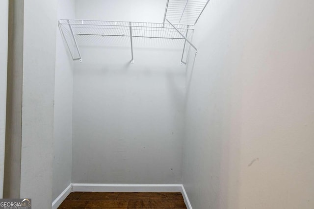 2836 Harlan Dr, Atlanta, GA 30344 - walk in closet with attic access and dark wood finished floors