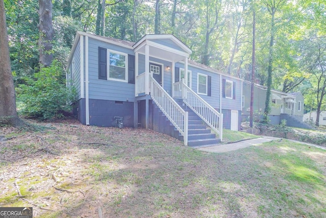 2836 Harlan Dr, Atlanta, GA 30344 - view of front of property with stairway, a front yard, crawl space, and a porch