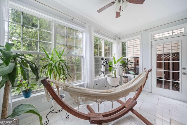 sunroom / solarium with ceiling fan