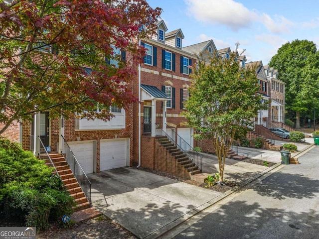 multi unit property featuring a garage