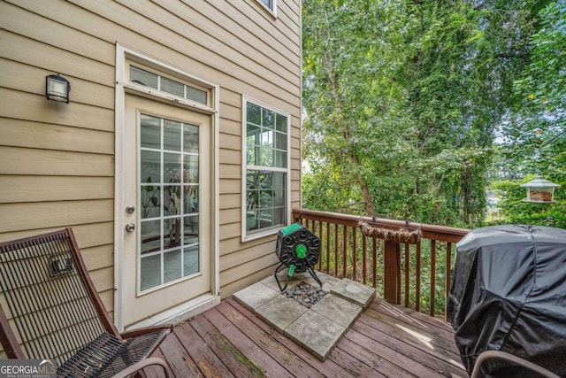 wooden deck featuring area for grilling