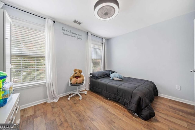 bedroom with wood-type flooring