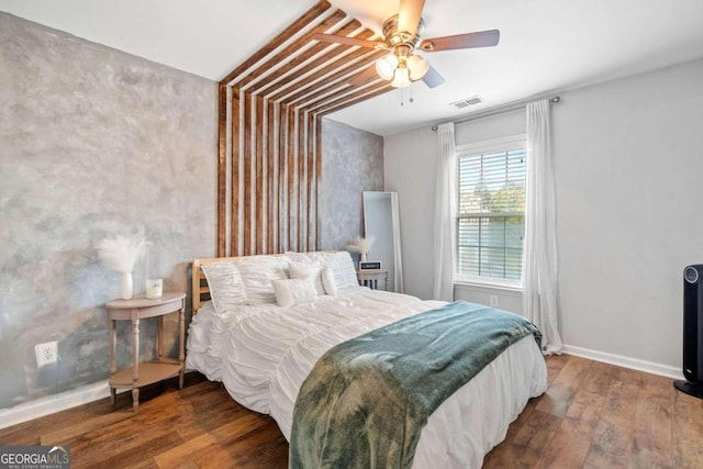 bedroom featuring ceiling fan and hardwood / wood-style floors