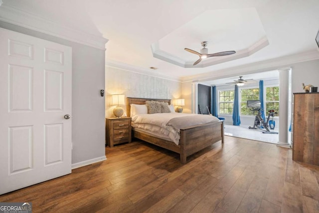 bedroom featuring wood-type flooring, ornamental molding, access to exterior, and ceiling fan