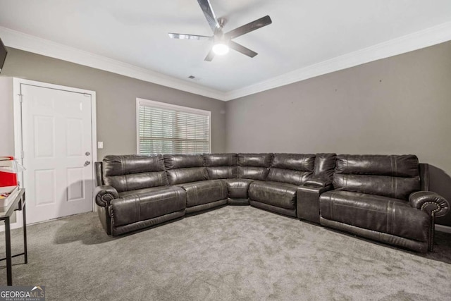 carpeted living room featuring ornamental molding and ceiling fan