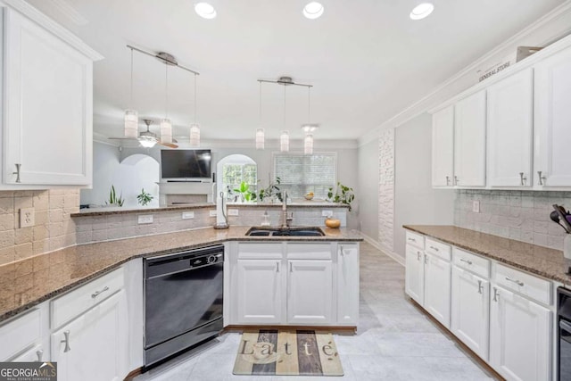 kitchen with dishwasher, hanging light fixtures, sink, and white cabinetry