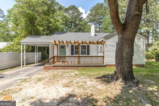 view of front of home featuring a carport