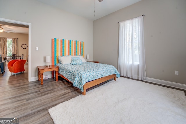 bedroom featuring wood-type flooring and ceiling fan