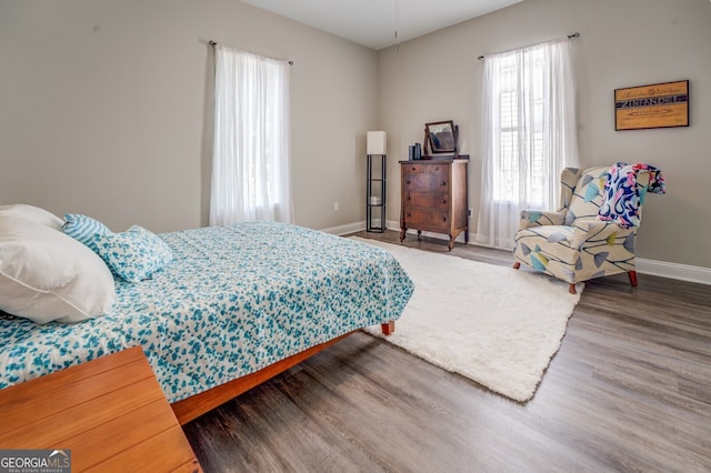 bedroom with hardwood / wood-style floors