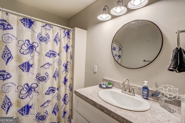 bathroom with vanity and a shower with shower curtain