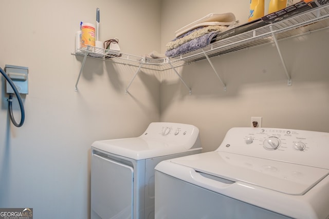 washroom with washing machine and dryer