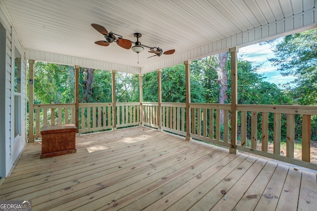 wooden deck featuring ceiling fan