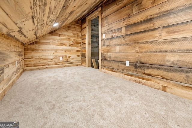 additional living space with wooden ceiling, wood walls, carpet flooring, and vaulted ceiling