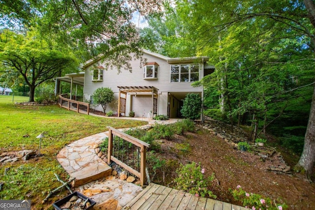 view of front of home with a front lawn and a deck