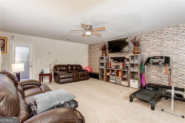 carpeted living room with ceiling fan