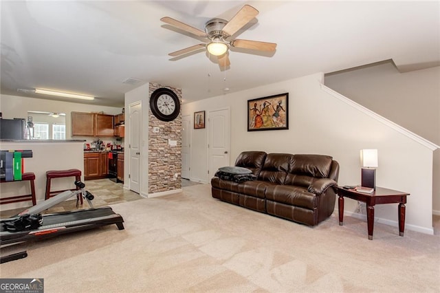 living room featuring ceiling fan and light carpet