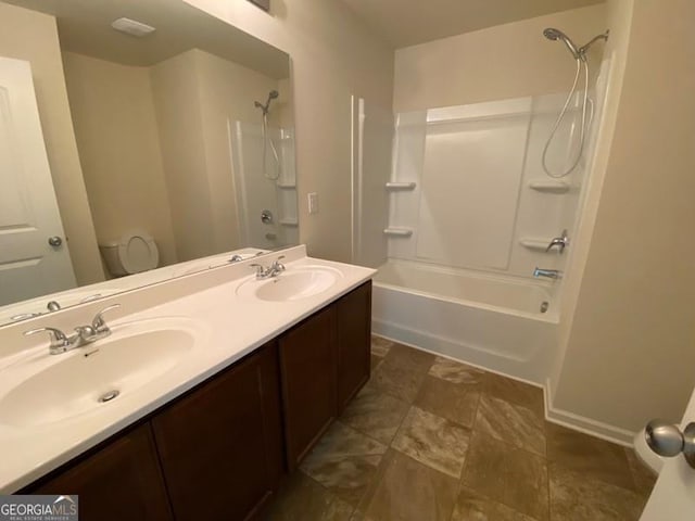 full bathroom with vanity, bathtub / shower combination, and toilet