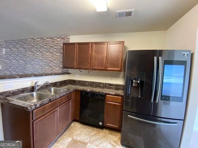 kitchen with stainless steel fridge, dishwasher, sink, and tasteful backsplash