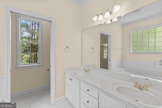 bathroom with independent shower and bath, ornamental molding, vanity, and a wealth of natural light