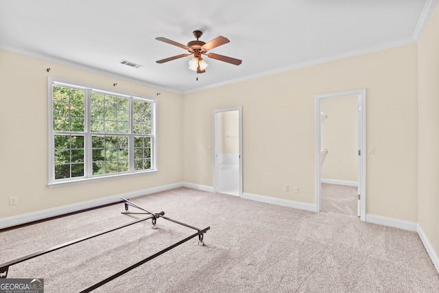 unfurnished room with ornamental molding, ceiling fan, and light carpet