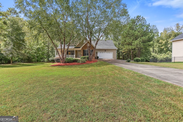 view of front of house with a front yard and a garage