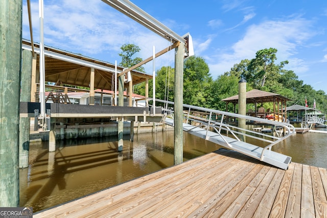 dock area with a water view