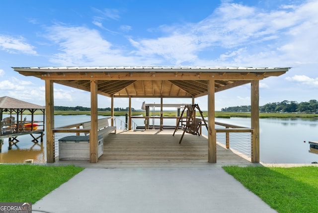 view of dock featuring a water view and a gazebo