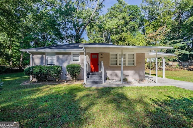 view of front facade with a carport and a front yard