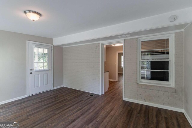 entrance foyer featuring dark wood-type flooring