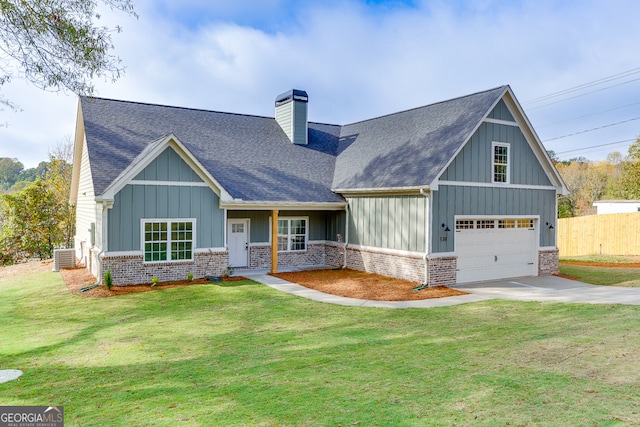 craftsman inspired home with a garage and a front yard