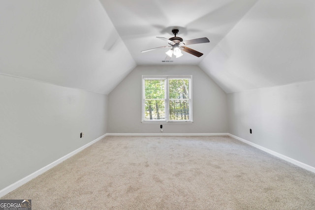 bonus room with carpet floors, vaulted ceiling, and ceiling fan