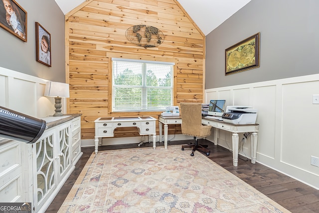 office area featuring wood walls, vaulted ceiling, and dark hardwood / wood-style floors