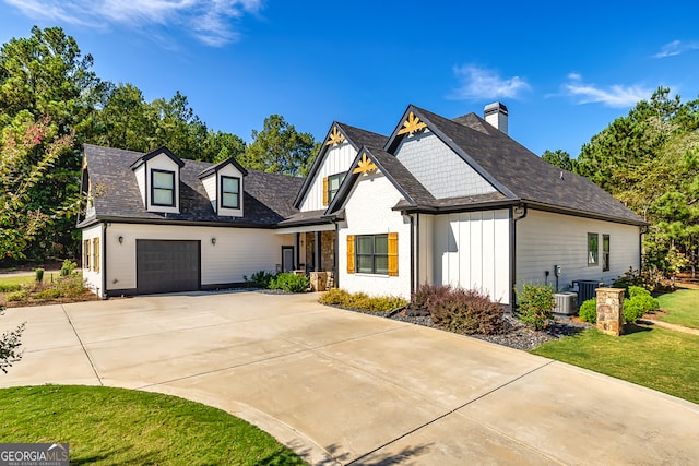 view of front facade with a garage and a front lawn