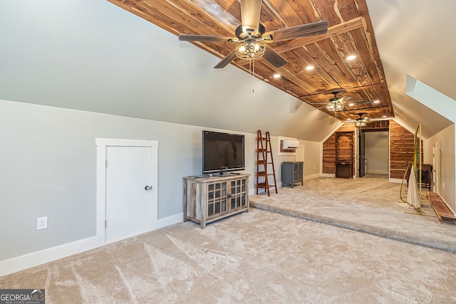 unfurnished living room with ceiling fan, vaulted ceiling, carpet floors, and wooden ceiling