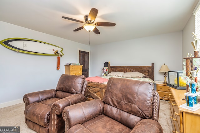 carpeted bedroom featuring ceiling fan and multiple windows