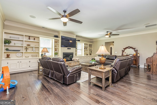 living room with ornamental molding, hardwood / wood-style flooring, a wealth of natural light, and ceiling fan