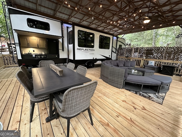 deck with an outdoor hangout area