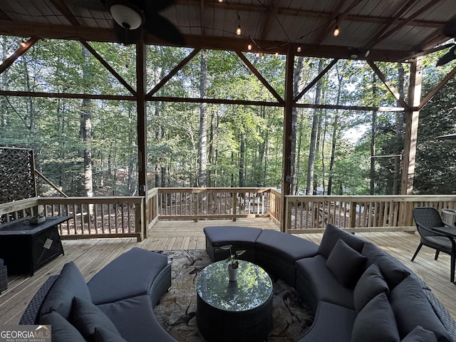 wooden deck featuring an outdoor hangout area