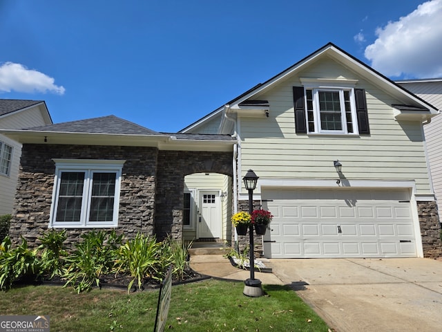 view of front facade with a front lawn and a garage