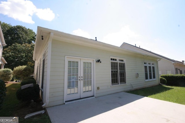 back of house featuring french doors and a patio