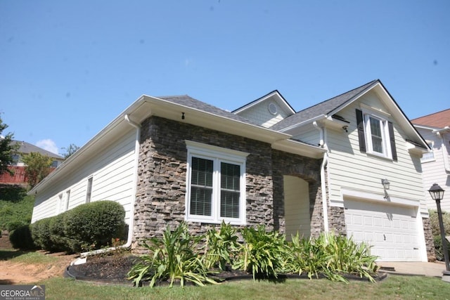 view of side of home featuring a garage