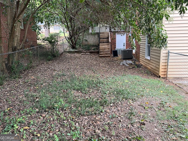 view of yard with central AC unit