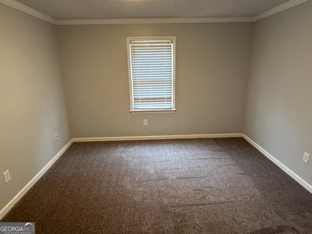 spare room with carpet floors, a textured ceiling, and ornamental molding