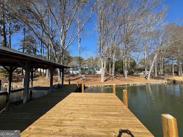 dock area featuring a water view