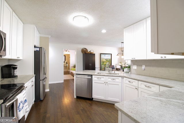 kitchen featuring white cabinetry, sink, dark wood-type flooring, and stainless steel appliances