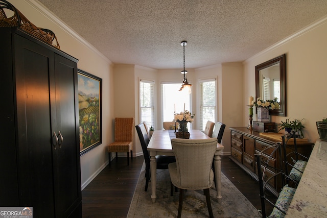 dining space featuring ornamental molding, a textured ceiling, and dark wood-type flooring