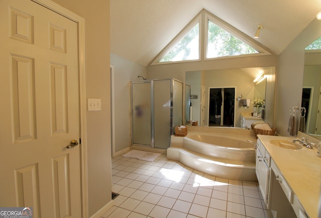 bathroom featuring shower with separate bathtub, tile patterned flooring, vanity, and vaulted ceiling